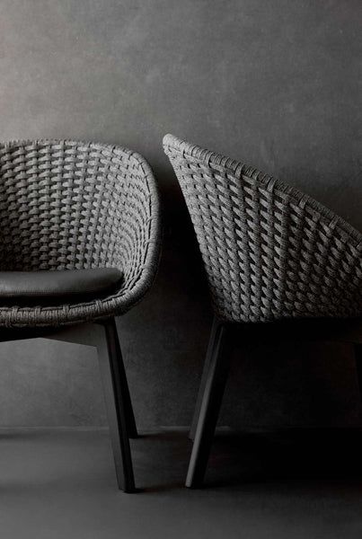 Peacock Indoor Dining Chair by Cane-Line, showing peacock indoor dining chairs in live shot.
