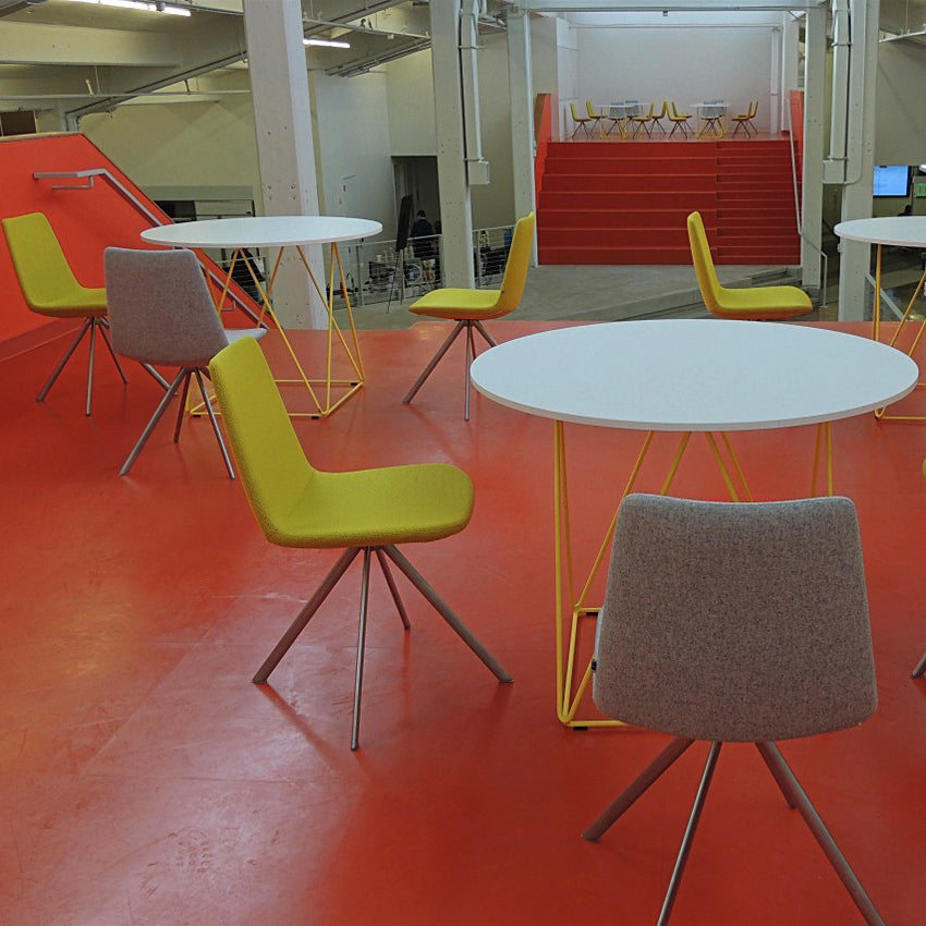 Pera Chair by B&T, showing pera chairs in live shot.
