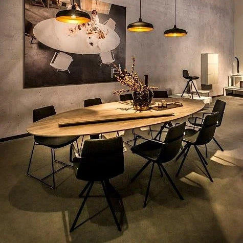Pera Ellipse Swivel Armchair by B&T, showing pera ellipse swivel armchairs in live shot.
