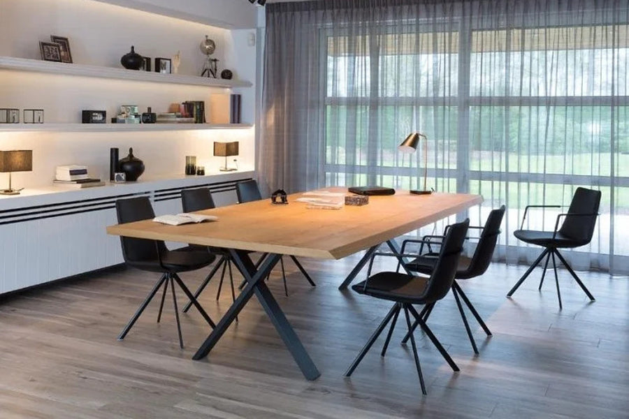 Pera Ellipse Swivel Armchair by B&T, showing pera ellipse swivel armchairs in live shot.