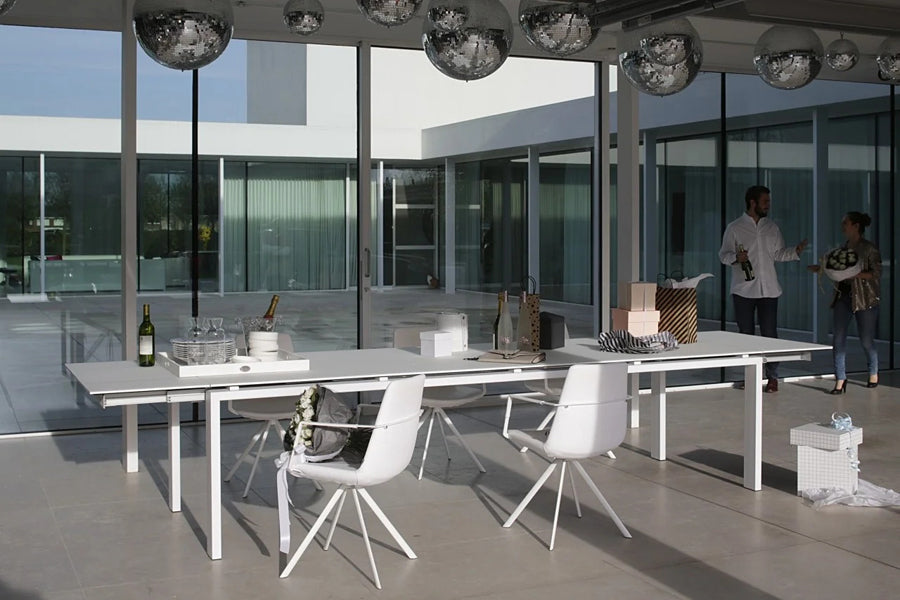 Pera Ellipse Swivel Armchair by B&T, showing pera ellipse swivel armchairs in live shot.