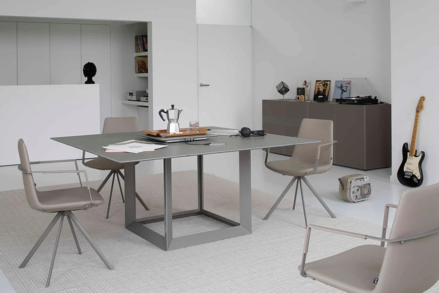 Pera Ellipse Swivel Armchair by B&T, showing pera ellipse swivel armchairs in live shot.