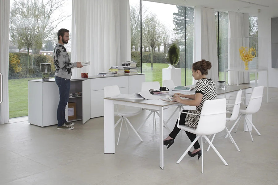 Pera Ellipse Swivel Armchair by B&T, showing pera ellipse swivel armchairs in live shot.