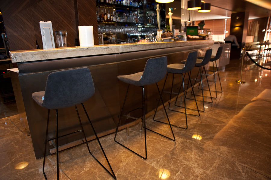 Pera Sled Stool by B&T, showing pera sled stools in live shot.