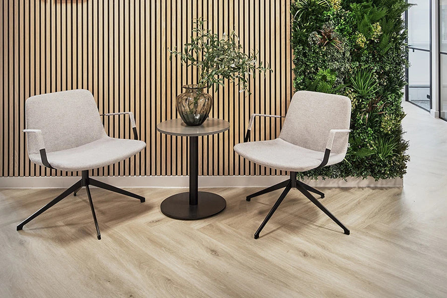 Pera Swivel Lounge Chair by B&T, showing pera swivel lounge chairs in live shot.
