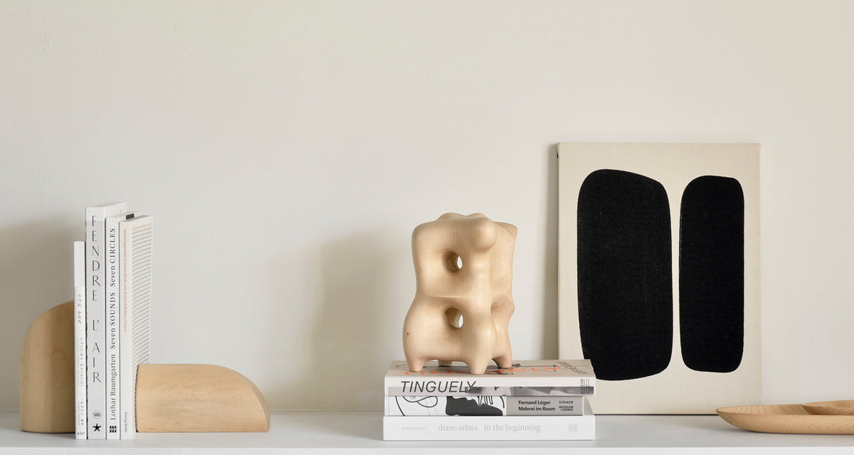 PI Book Ends by Ethnicraft, showing pi book ends in live shot.