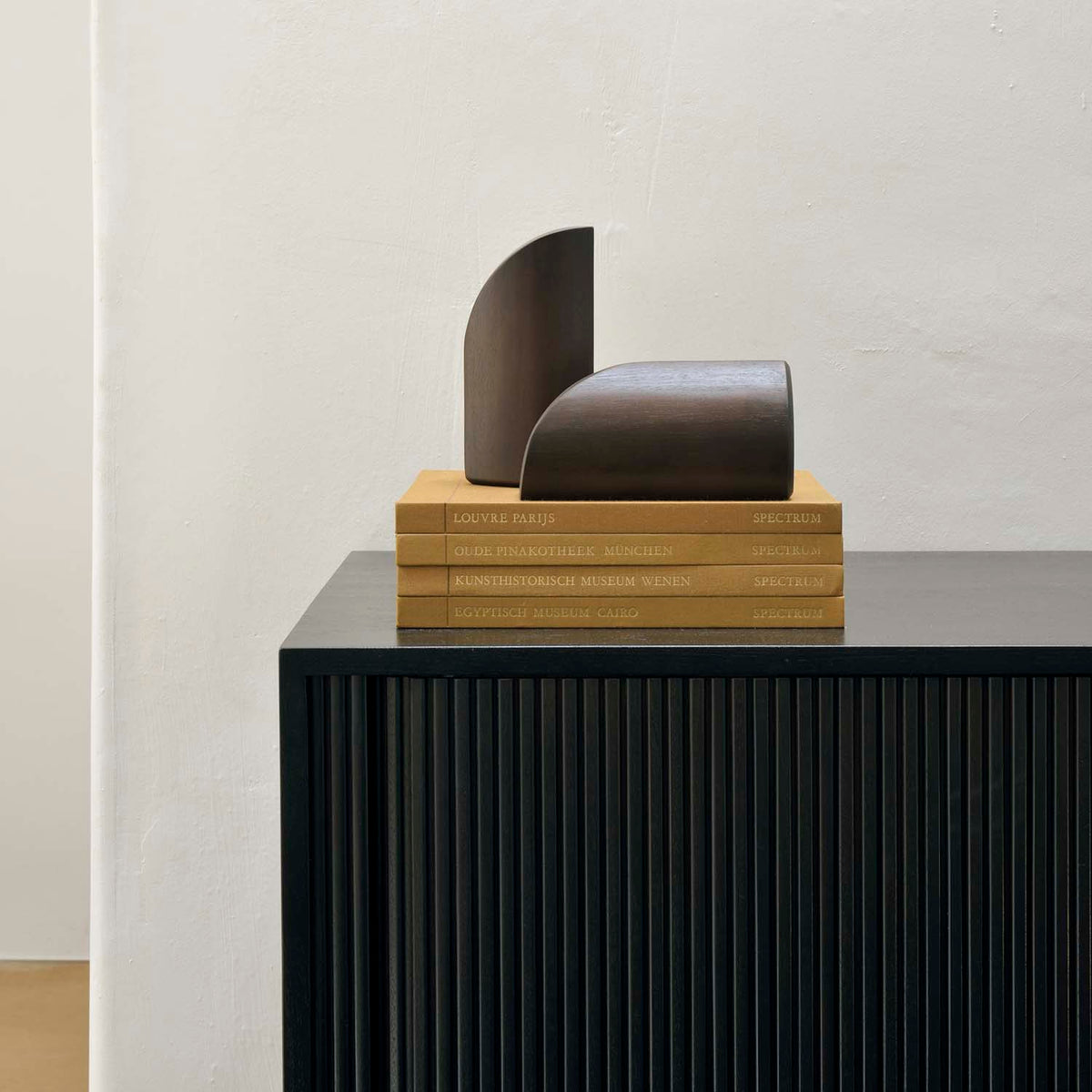 PI Book Ends by Ethnicraft, showing pi book ends in live shot.