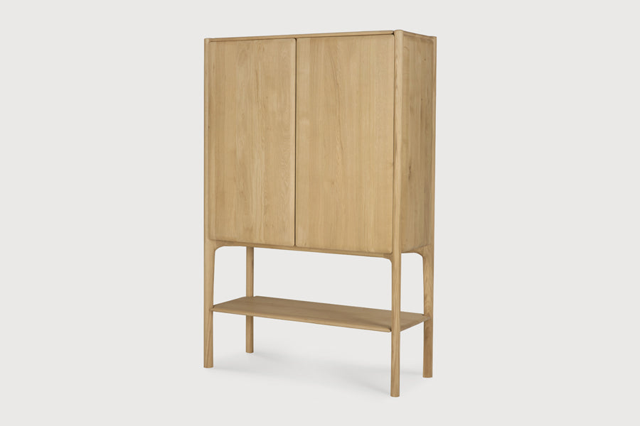 PI Cupboard by Ethnicraft, showing angle view of pi cupboard in studio shot.