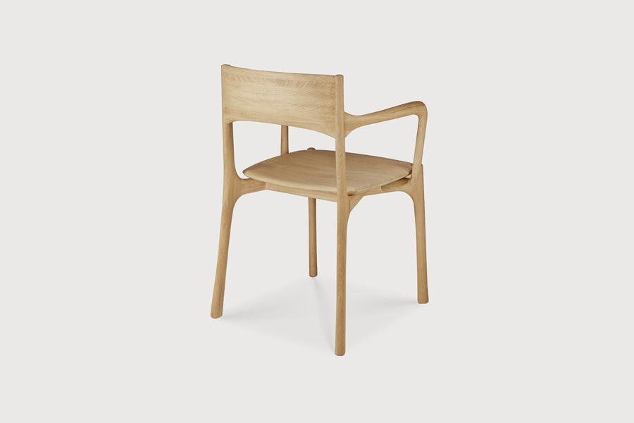 PI Dining Chair by Ethnicraft, showing back view of pi dining chair in live shot.