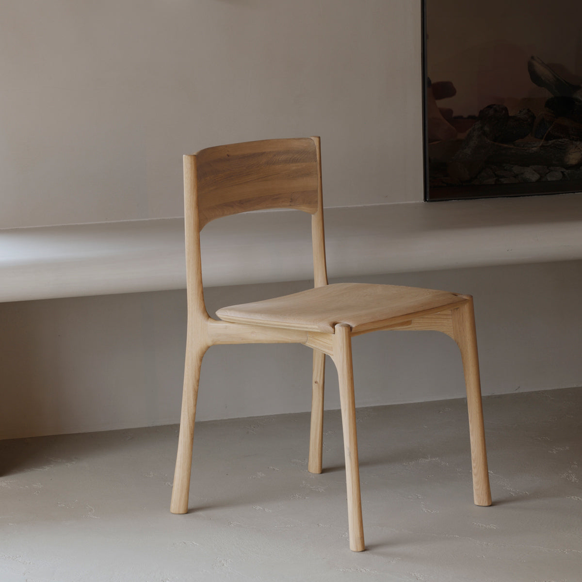 PI Dining Chair by Ethnicraft, showing pi dining chair in live shot.