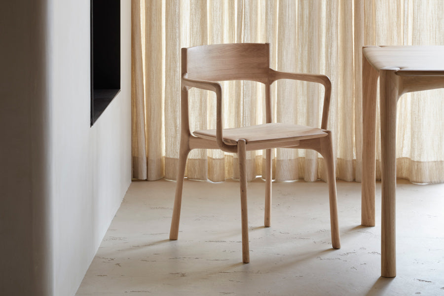 PI Dining Chair by Ethnicraft, showing pi dining chair in live shot.
