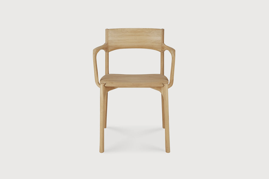 PI Dining Chair by Ethnicraft, showing front view of pi dining chair in live shot.