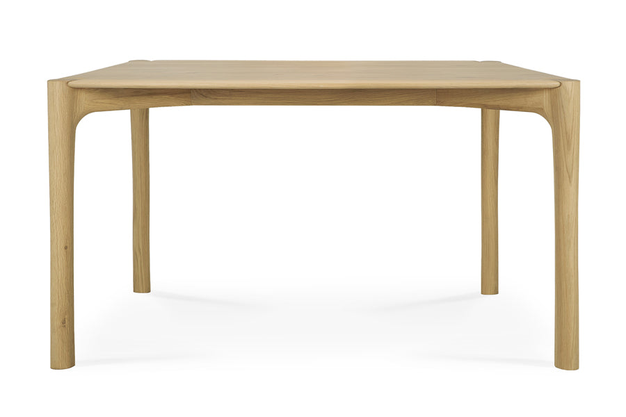 PI Dining Table by Ethnicraft, showing front view of pi dining table in oak.
