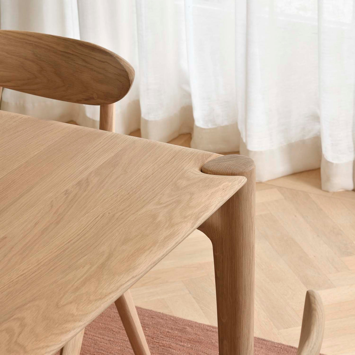 PI Dining Table by Ethnicraft, showing closeup view of pi dining table.