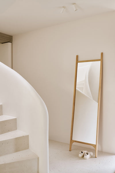 PI Floor Mirror by Ethnicraft, showing pi floor mirror in live shot.