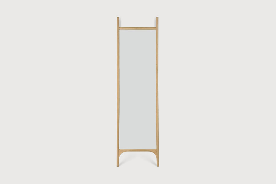 PI Floor Mirror by Ethnicraft, showing front view of pi floor mirror in studio shot.