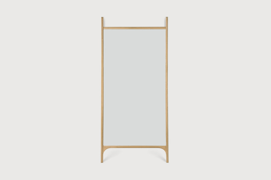 PI Floor Mirror by Ethnicraft, showing front view of pi floor mirror in studio shot.