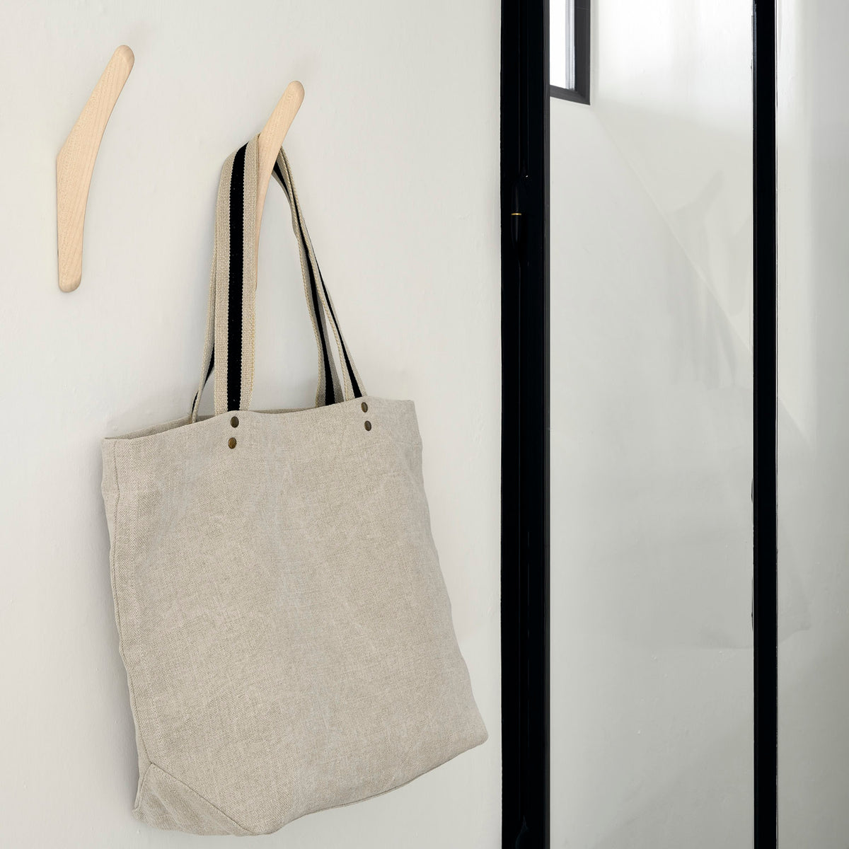 PI Wall Hanger by Ethnicraft, showing pi wall hanger in live shot.