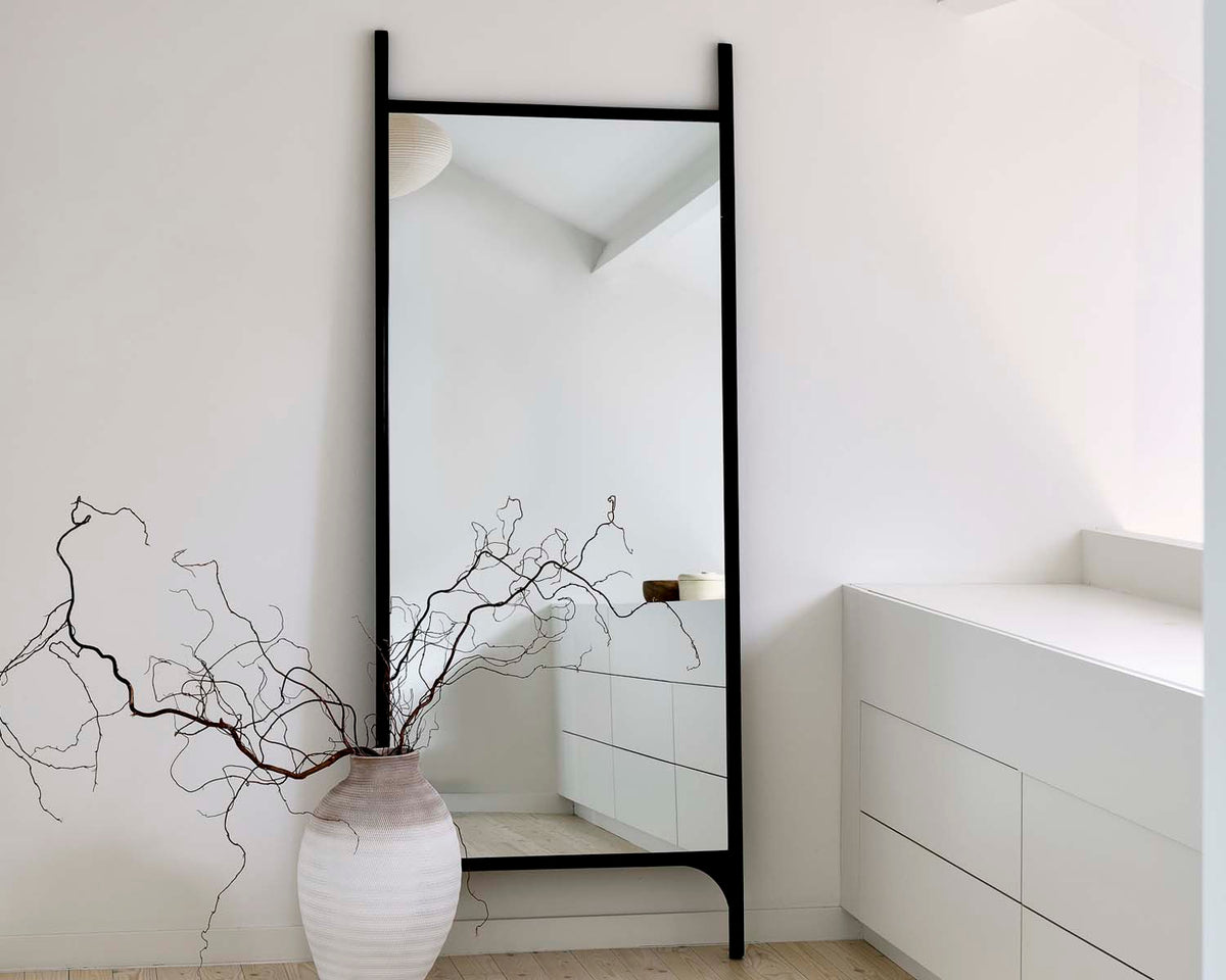 PI Floor Mirror by Ethnicraft, showing pi floor mirror in live shot.