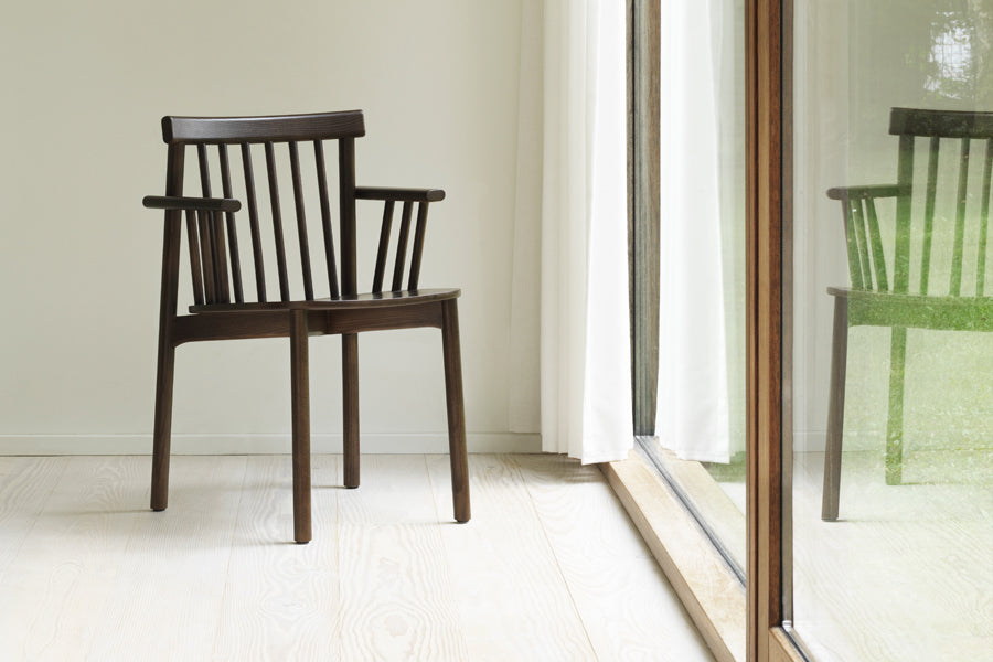 Pind Armchair by Normann Copenhagen, showing pind armchair in live shot.