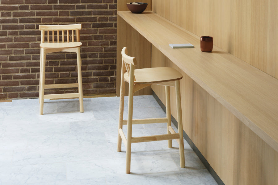 Pind Barstool by Normann Copenhagen, showing pind barstools in live shot.
