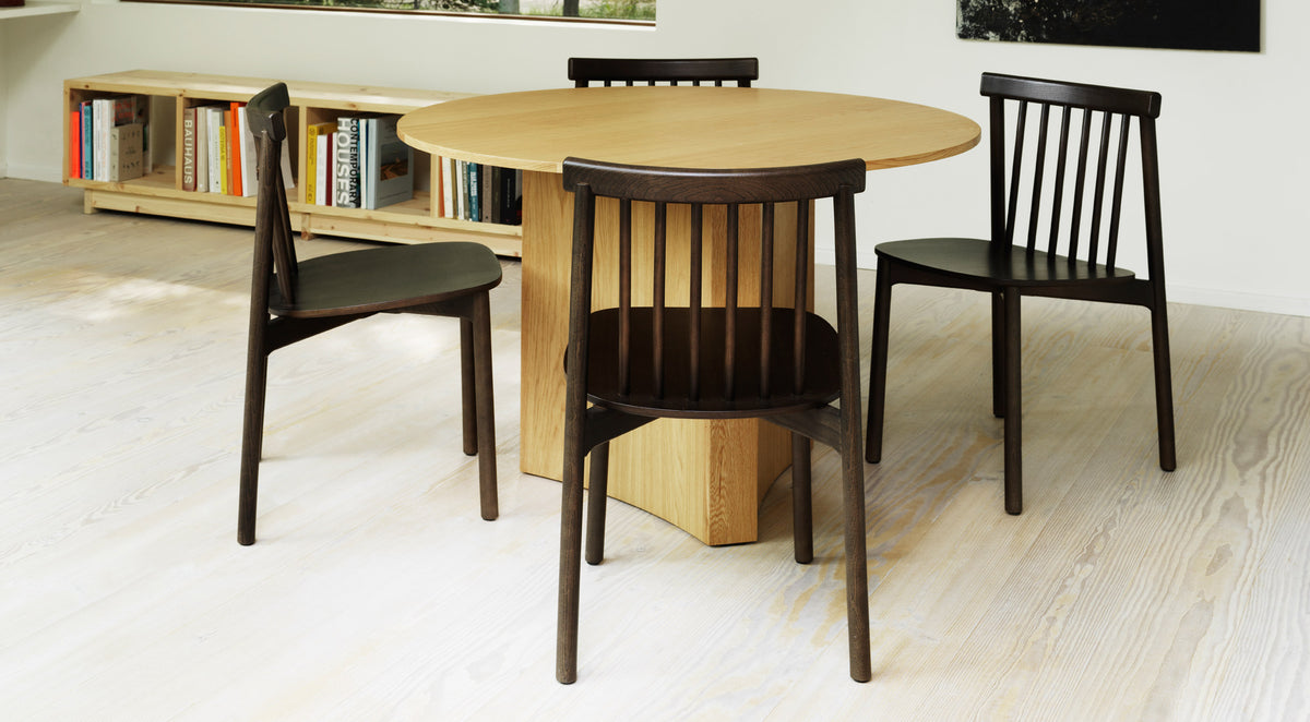 Pind Chair by Normann Copenhagen, showing pind chairs in live shot.