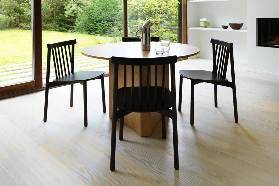Pind Chair by Normann Copenhagen, showing pind chairs in live shot.