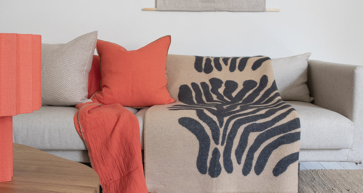 Pine Wool Blanket by Brita, showing pine wool blanket in live shot.
