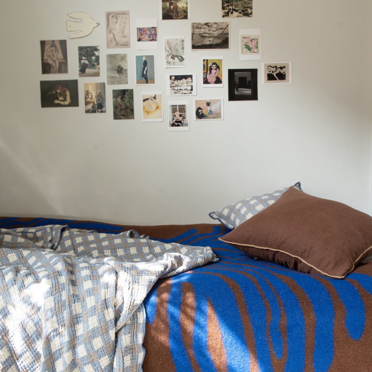 Pine Wool Blanket by Brita, showing pine wool blanket in live shot.