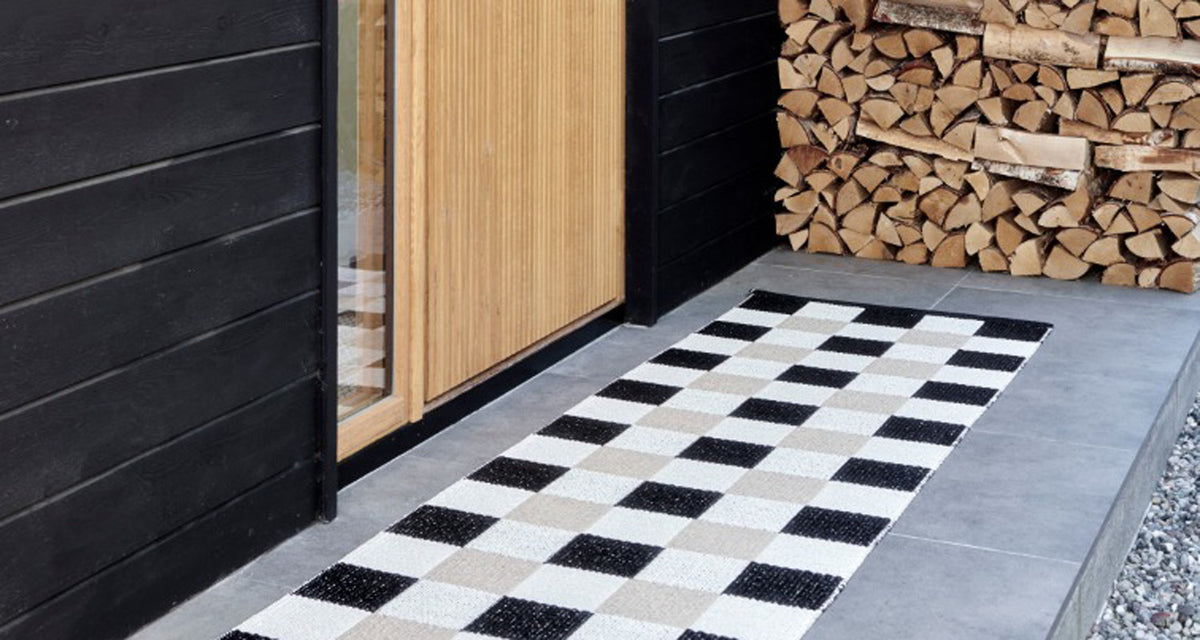 Pix Black & Vanilla with Beige Rug by Pappelina, showing pix black & vanilla with beige rug in live shot.