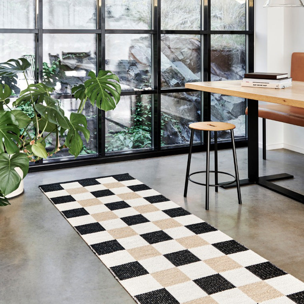 Pix Black & Vanilla with Beige Rug by Pappelina, showing pix black & vanilla with beige rug in live shot.