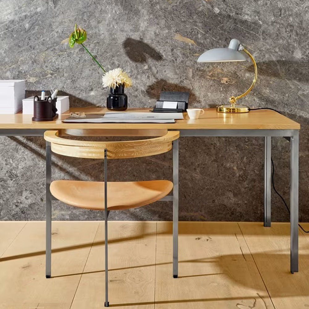 PK11 Armchair by Fritz Hansen, showing pk11 armchair in live shot.