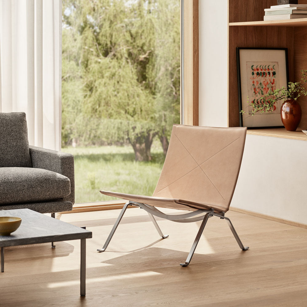 PK22 Lounge Chair by Fritz Hansen, showing pk22 lounge chair in live shot.