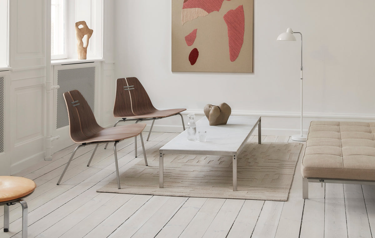 PK23 Lounge Chair by Fritz Hansen, showing pk23 lounge chairs in live shot.