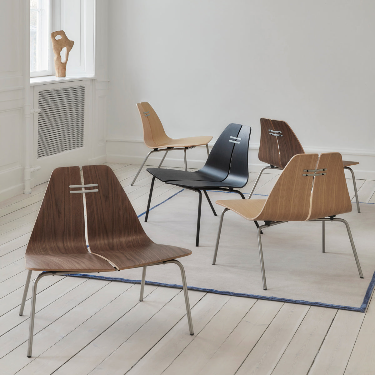 PK23 Lounge Chair by Fritz Hansen, showing pk23 lounge chairs in live shot.