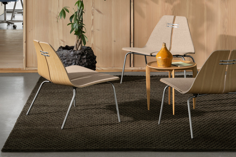PK23 Lounge Chair by Fritz Hansen, showing pk23 lounge chairs in live shot.