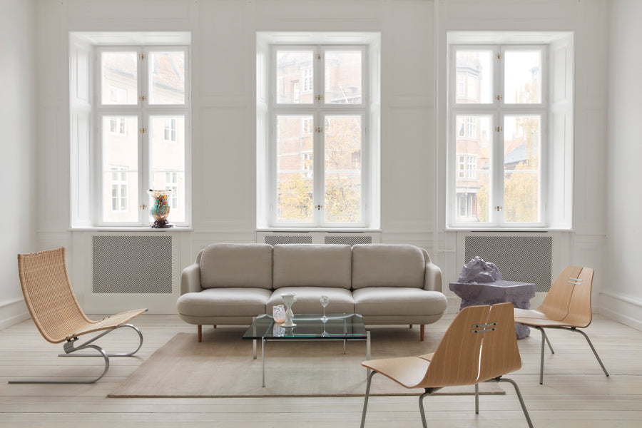 PK23 Lounge Chair by Fritz Hansen, showing pk23 lounge chairs in live shot.