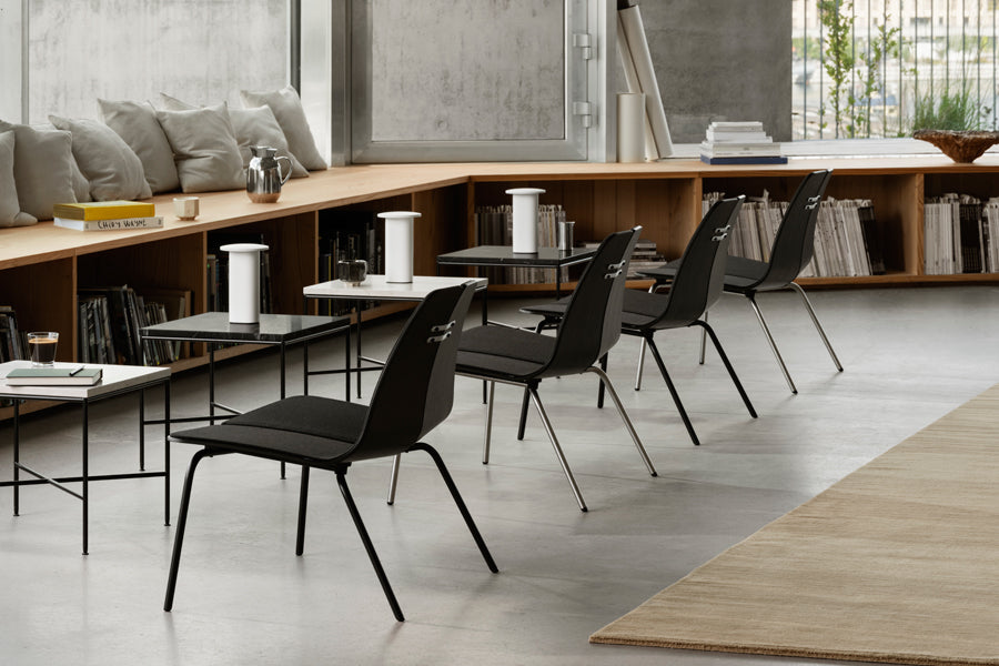 PK23 Lounge Chair by Fritz Hansen, showing pk23 lounge chairs in live shot.