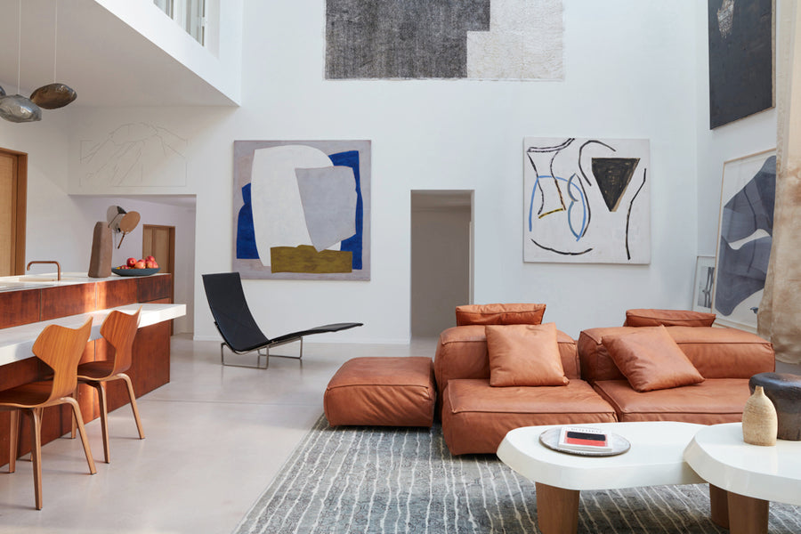 PK24 Chaise Lounge Chair by Fritz Hansen, showing pk24 chaise lounge chair in live shot.