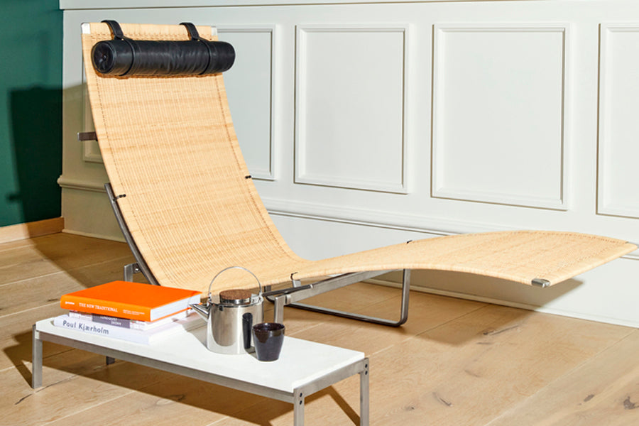 PK24 Chaise Lounge Chair by Fritz Hansen, showing pk24 chaise lounge chair in live shot.