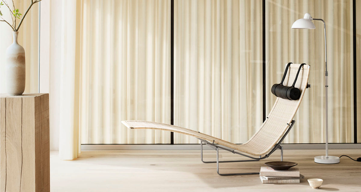 PK24 Chaise Lounge Chair by Fritz Hansen, showing pk24 chaise lounge chair in live shot.