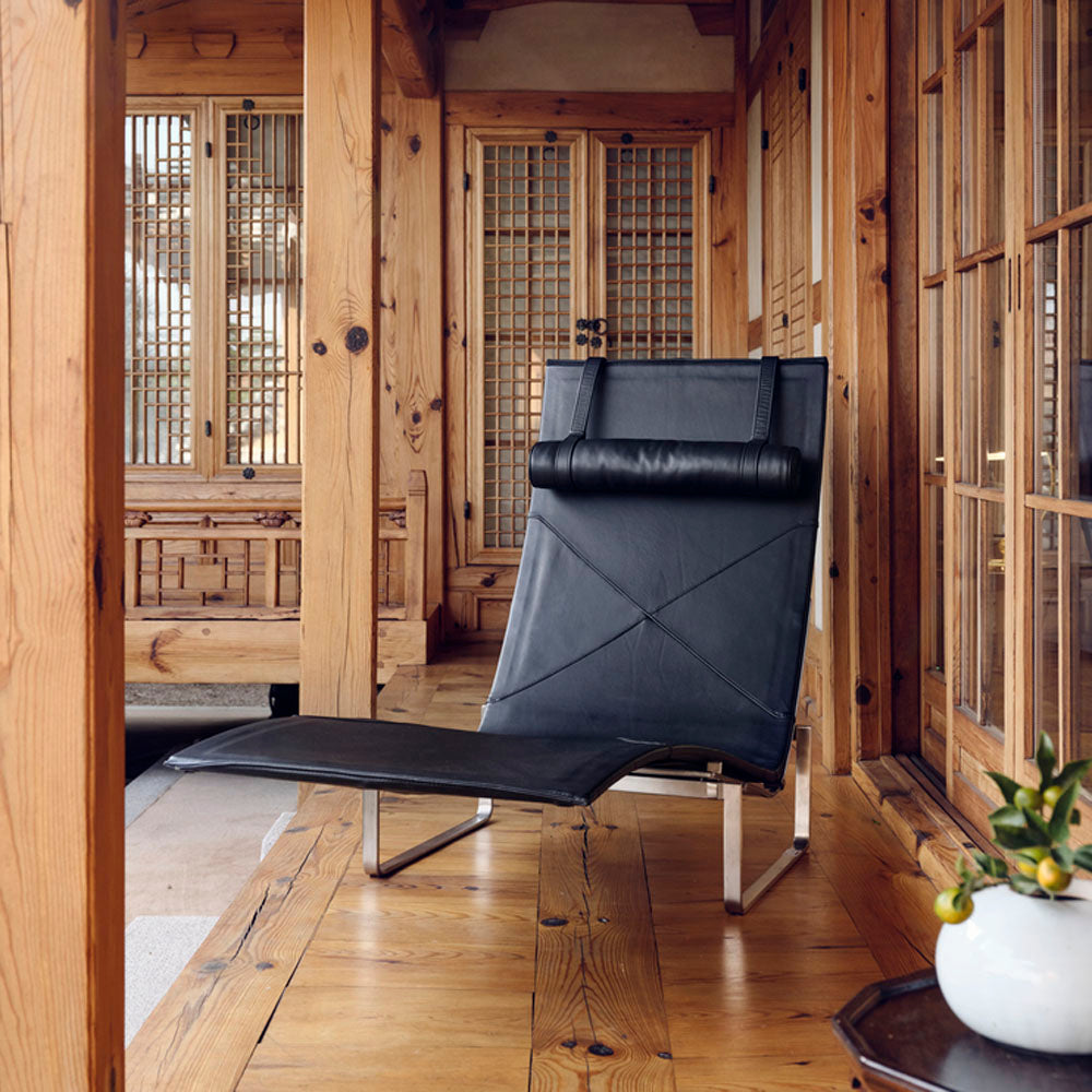 PK24 Chaise Lounge Chair by Fritz Hansen, showing pk24 chaise lounge chair in live shot.