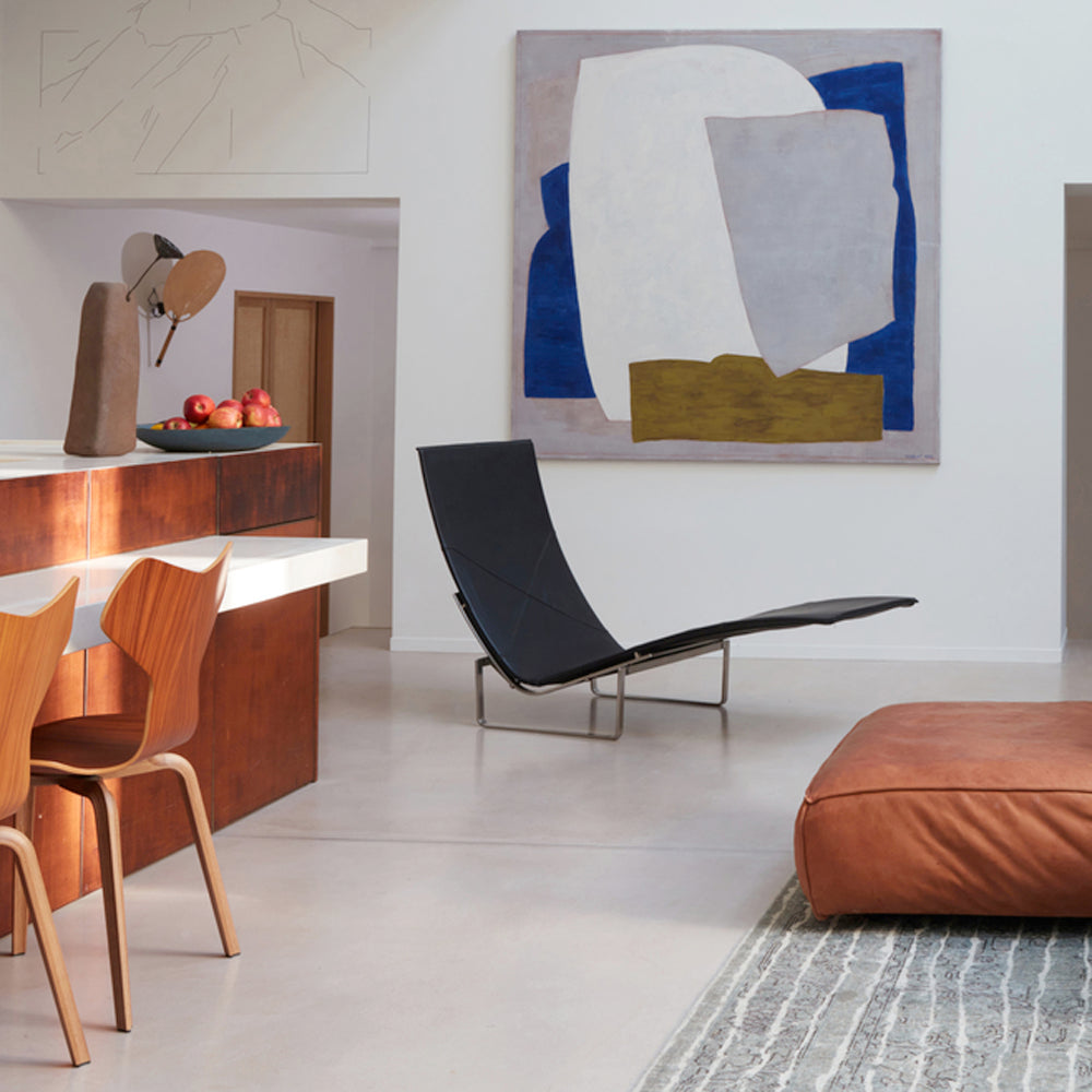 PK24 Chaise Lounge Chair by Fritz Hansen, showing pk24 chaise lounge chair in live shot.