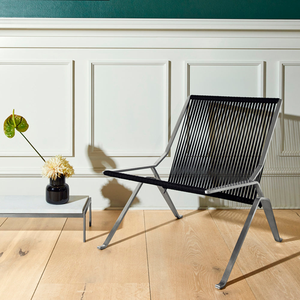 PK25 Lounge Chair by Fritz Hansen, showing pk25 lounge chair in live shot.