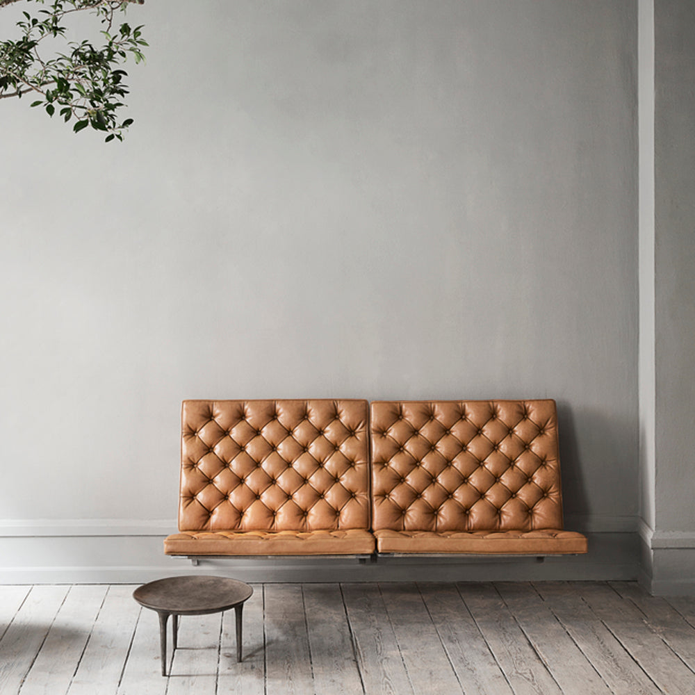 PK26 Wall-Mounted Modular Sofa by Fritz Hansen, showing pk26 wall-mounted modular sofa in live shot.
