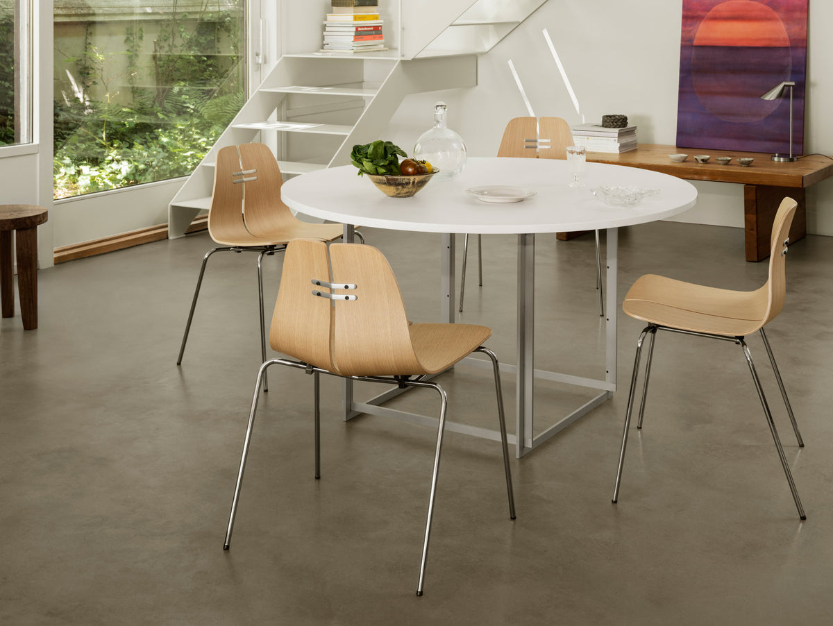 PK3 Chair by Fritz Hansen, showing pk chairs in live shot.