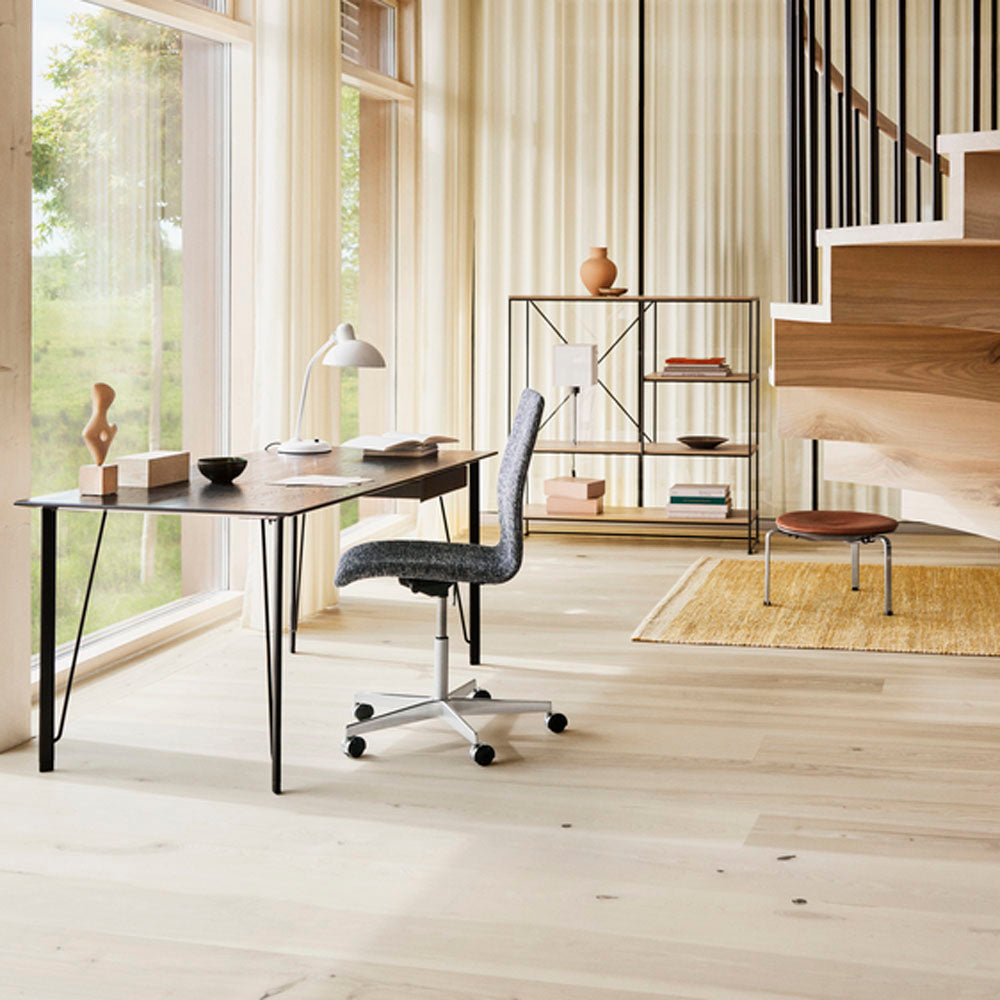 PK33 Stool by Fritz Hansen, showing pk33 stool in live shot.