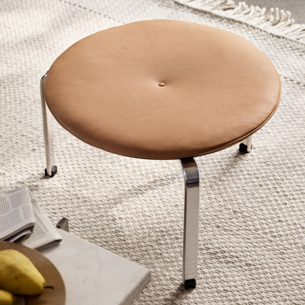 PK33 Stool by Fritz Hansen, showing pk33 stool in live shot.