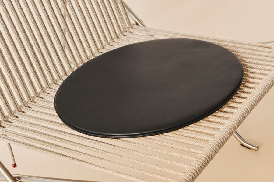 PK4 Lounge Chair by Fritz Hansen, showing closeup view of pk4 lounge chair.