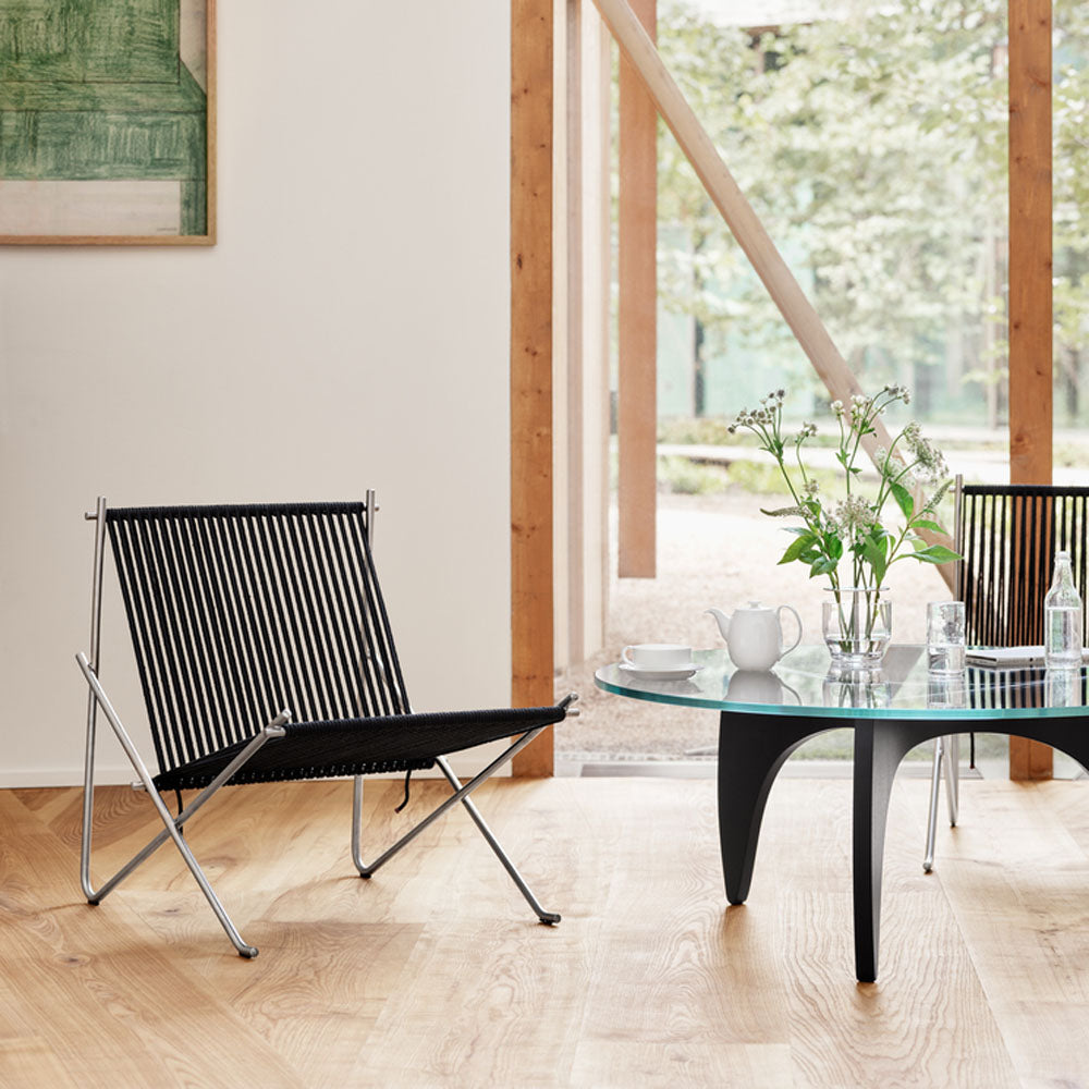 PK4 Lounge Chair by Fritz Hansen, showing pk4 lounge chair in live shot.